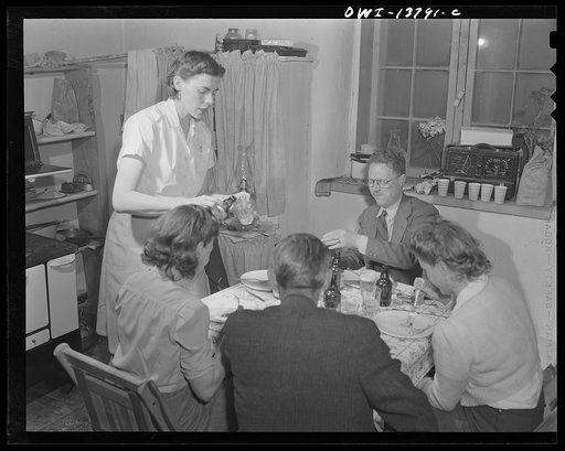 Untitled photo, possibly related to: Penasco, New Mexico. Marjorie Muller, resident nurse, entertaining in her one-room home in the clinic