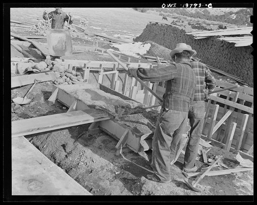 Untitled photo, possibly related to: Penasco, New Mexico. Pouring the foundations of the new building for the clinic operated by the Taos County cooperative health association