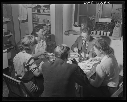 Penasco, New Mexico. Marjorie Muller, resident nurse, entertaining in her one-room home in the clinic