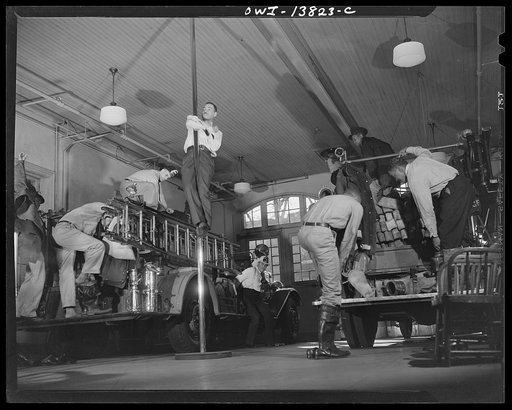 Firehouse Station No. 4. Washington, D.C. When the gong sounds the alarm, the firemen jump into their boots and get into their helmets and coats while the truck is on its way to the fire. Once the alarm is sounded the complete operation of getting dressed and leaving the building takes about seven s