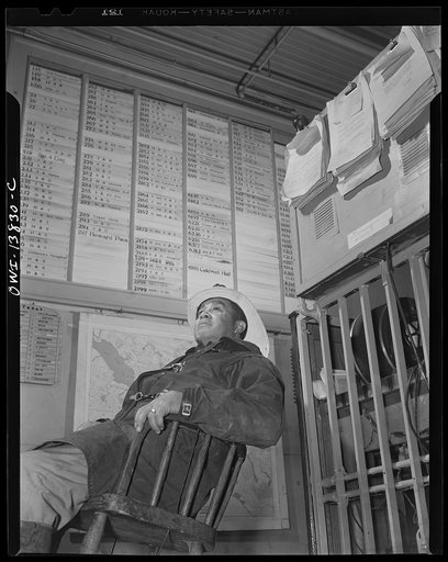Firehouse Station No. 4. Washington, D.C. Fireman sitting in formt of a control board