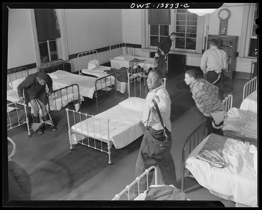 Firehouse Station No. 4. Washington, D.C. Firemen sleep in their shirts and socks and when the alarm sounds they jump into their boots which have fireproofed pants attached, slide down the pole, jump onto the truck and are leaving the building within seven seconds