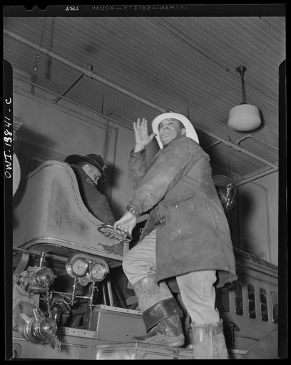 Firehouse Station No. 4. Washington, D.C. Captain Keye shouting location of the alarm above the roar of the truck motors
