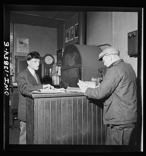 Freight operations on the Indiana Harbor Belt railroad between Chicago, Illinois and Hammond, Indiana. Conductor Cunningham reports at the yard office where the yard clerk gives him the waybills for the train and instructions to deliver it