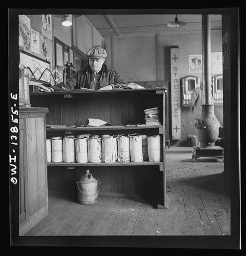 Freight operations on the Indiana Harbor Belt railroad between Chicago, Illinois and Hammond, Indiana. Getting his way bills, Conductor Cunningham telephones his own yard-master the number of cars he has to handle and where the delivery is to be made