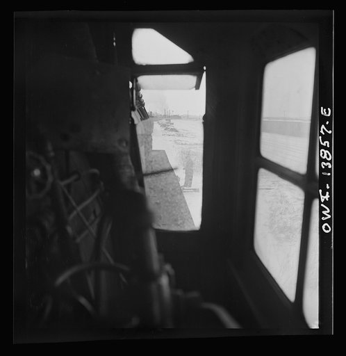 Freight operations on the Indiana Harbor Belt railroad between Chicago, Illinois and Hammond, Indiana. View through the window of the engineer's side of the cab. Ready to pull out of the yard, the engineer waits for the switchman to throw the switch
