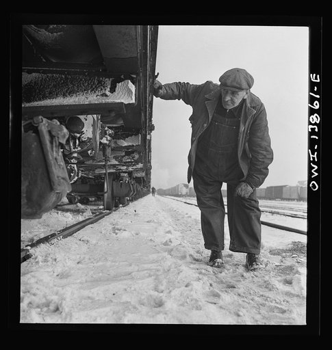 Freight operations on the Indiana Harbor Belt railroad between Chicago, Illinois and Hammond, Indiana. Arriving at a Chicago and Northwestern Railroad yard, an inspection is made of the train the crew is to deliver