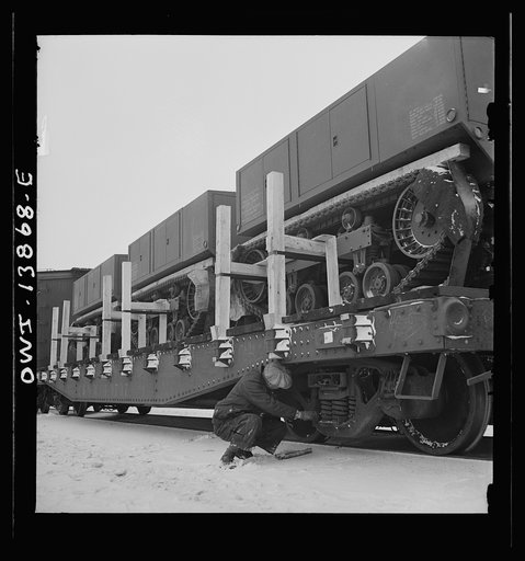 Freight operations on the Indiana Harbor Belt railroad between Chicago, Illinois and Hammond, Indiana. Conductor Cunningham makes an inspection of the train he is to deliver while on his way to the yard office