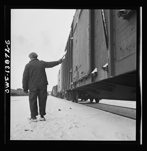 Freight operations on the Indiana Harbor Belt railroad between Chicago, Illinois and Hammond, Indiana. Having inspected the train, the conductor signals the ok with a "fusee"