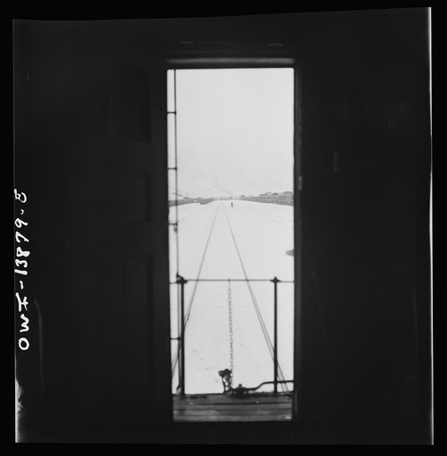 Untitled photo, possibly related to: Freight operations on the Indiana Harbor Belt railroad between Chicago, Illinois and Hammond, Indiana. While waiting for a signal, another train pulls up behind conductor Cunningham's