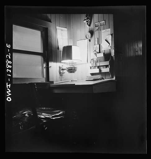 Freight operations on the Indiana Harbor Belt railroad between Chicago, Illinois and Hammond, Indiana. The conductor's work desk in the caboose. The dial on the wall is an air pressure gauge