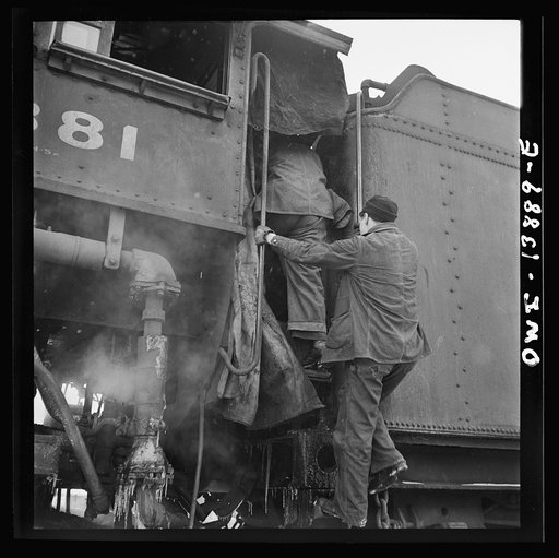 Untitled photo, possibly related to: Freight operations on the Indiana Harbor Belt railroad between Chicago, Illinois and Hammond, Indiana. The engineer and fireman get aboard the locomotive to start out