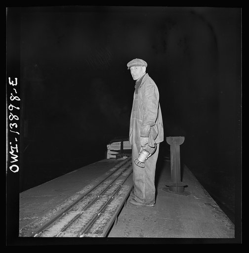 Freight operations on the Indiana Harbor Belt railroad between Chicago, Illinois and Hammond, Indiana. All during a detour over territory not belonging to this road, caused by a derailment at Calumet City, brakeman Lee High stays atop the caboose to be ready to signal the engineer