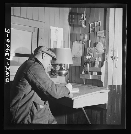 Untitled photo, possibly related to: Freight operations on the Indiana Harbor Belt railroad between Chicago, Illinois and Hammond, Indiana. As soon as the train is under way, Conductor Cunningham gets to work on his bills and records