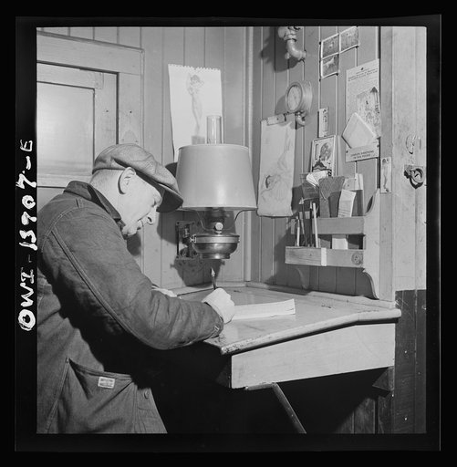 Untitled photo, possibly related to: Freight operations on the Indiana Harbor Belt railroad between Chicago, Illinois and Hammond, Indiana. As soon as the train is under way, Conductor Cunningham gets to work on his bills and records