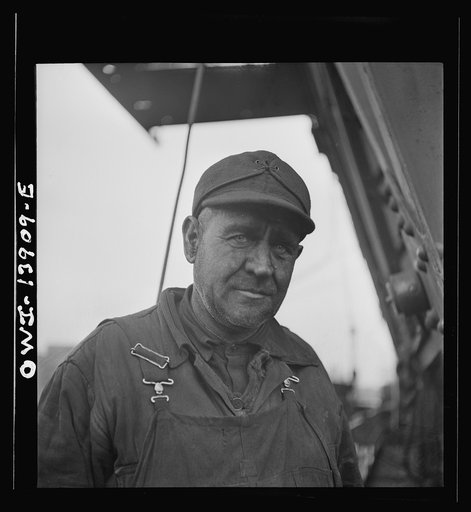 A worker employed at the car-loading end of a bridge at the Milwaukee Western Fuel Company. Milwaukee, Wisconsin