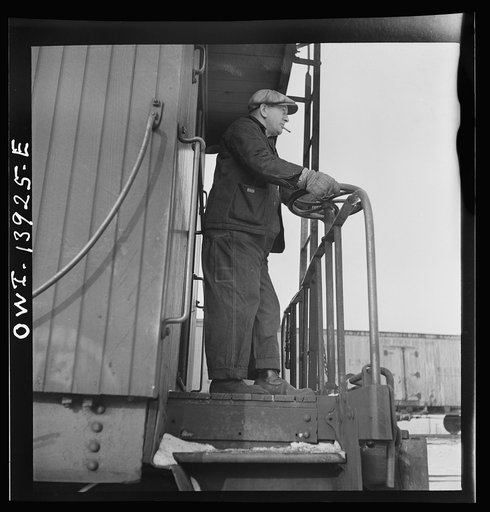 Freight operations on the Indiana Harbor Belt railroad between Chicago, Illinois and Hammond, Indiana. The conductor uses hand brakes on the caboose to stop it as it coasts down a siding