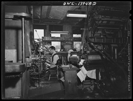 New York, New York. Linotypers in the Cocce press on Barrow Street. All workers are Italian-Americans. They print the weekly newspaper La Parola, among others. The make-up desk is in the background