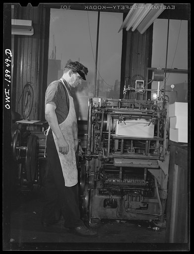 New York, New York. A pressman in the Cocce press in Barrow street