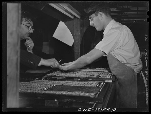 Untitled photo, possibly related to: New York, New York. Linotypers in the Cocce press on Barrow Street. All workers are Italian-Americans. They print the weekly newspaper La Parola, among others. The make-up desk is in the background