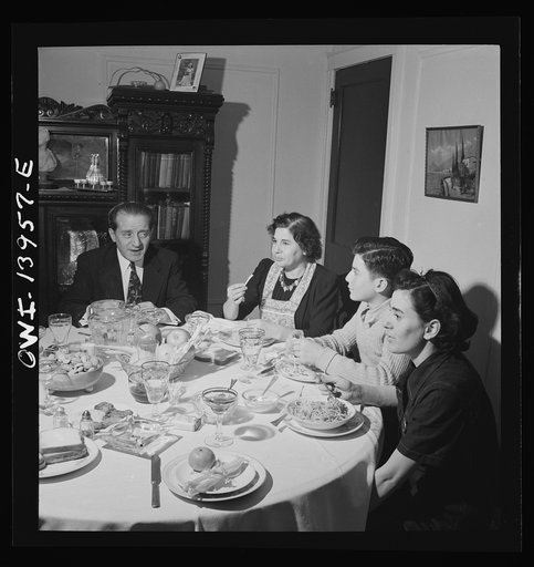 Corona, Long Island, New York. Raymond [i.e. Vincenzo] Fazio family at supper. Defense worker Jerry, the daughter, has just gotten home