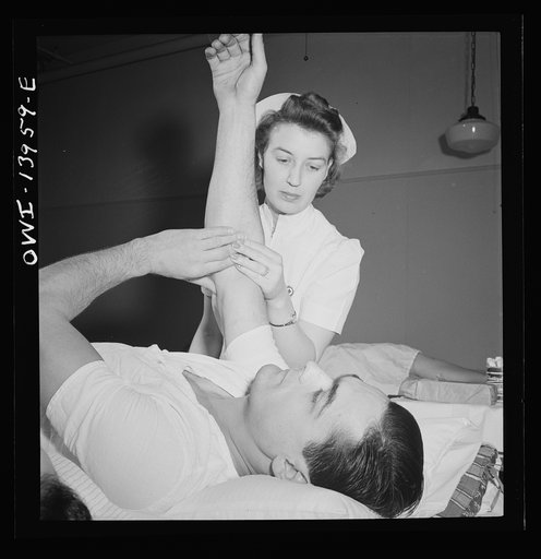 New York, New York. Italian-American fireman giving pint of blood to the Red Cross