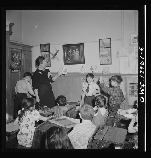 New York, New York. Class in Public School Eight on King Street, discussing a book entitled "We love America," brought to school by one of the pupils
