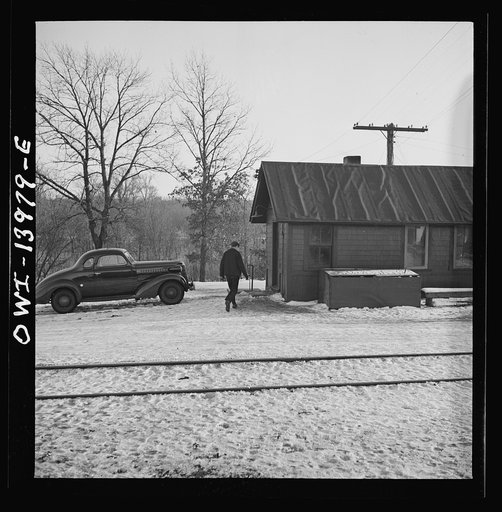 Freight train operations on the Chicago and Northwestern Railroad between Chicago and Clinton, Iowa. On arriving in the Clinton yard, the conductor immediately goes to the yard office to report with his waybills