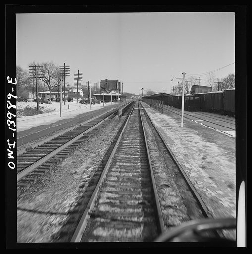 Freight train operations on the Chicago and Northwestern Railroad between Chicago and Clinton, Iowa. Without stopping, the train goes through Geneva, Illinois