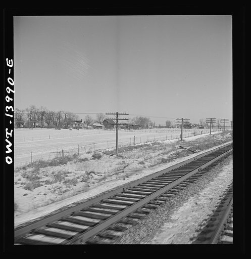Untitled photo, possibly related to: Freight train operations on the Chicago and Northwestern Railroad between Chicago and Clinton, Iowa. Reaching a speed of sixty-three miles per hour, the train speeds across northern Illinois