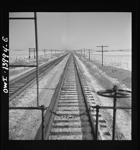 Untitled photo, possibly related to: Freight train operations on the Chicago and Northwestern Railroad between Chicago and Clinton, Iowa. Reaching a speed of sixty-three miles per hour, the train speeds across northern Illinois