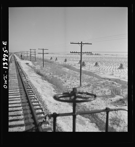 Untitled photo, possibly related to: Freight train operations on the Chicago and Northwestern Railroad between Chicago and Clinton, Iowa. Reaching a speed of sixty-three miles per hour, the train speeds across northern Illinois