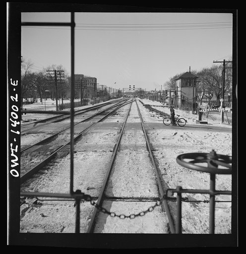 Freight train operations on the Chicago and Northwestern Railroad between Chicago and Clinton, Iowa. The train rushing through the town of Cortland, Illinois on its way to Iowa