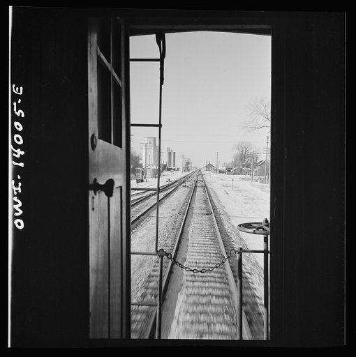 Freight train operations on the Chicago and Northwestern Railroad between Chicago and Clinton, Iowa. The train rushing through the town of Malta, Illinois on its way to Clinton