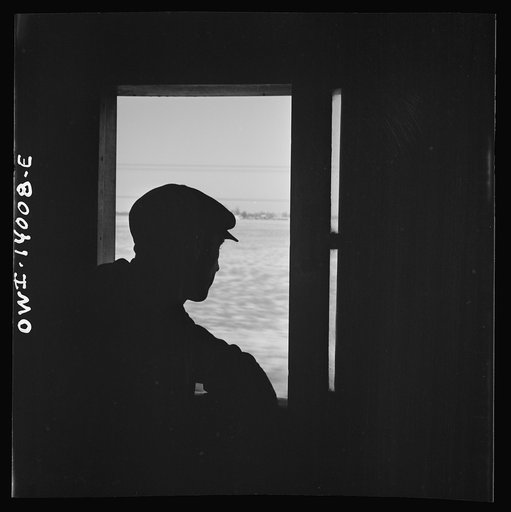 Untitled photo, possibly related to: Freight train operations on the Chicago and Northwestern Railroad between Chicago and Clinton, Iowa. Riding in the caboose can sometimes, on fairly long, fast runs, be very lonely with nothing to do but watch the landscape. The crew of a way-freight making delive