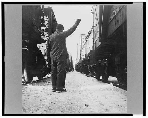 Freight operations on the Chicago and Northwestern Railroad between Chicago and Clinton, Iowa. The rear brakeman signals the engineer to test the brakes by applying and releasing them. This is the signal for "apply"