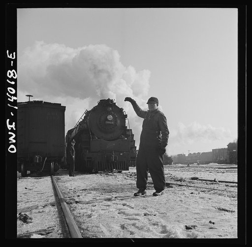 Untitled photo, possibly related to: Freight train operations on the Chicago and Northwestern Railroad between Chicago and Clinton, Iowa. Everything is clear and the head brakeman gives engineer the "high ball" or signal to start