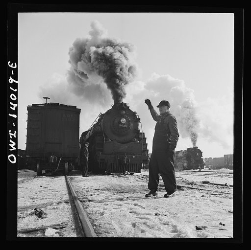 Freight train operations on the Chicago and Northwestern Railroad between Chicago and Clinton, Iowa. Everything is clear and the head brakeman gives engineer the "high ball" or signal to start