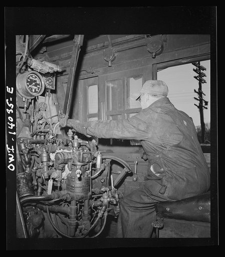 Freight train operations on the Chicago an Northwestern Railroad between Chicago and Clinton, Iowa. In the engineer's cab, after the train has arrived at Clinton and the engine is being taken over to the roundhouse. Note that the key has been put back into the automatic train control mechanism