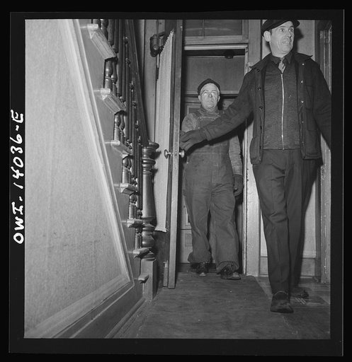 Clinton, Iowa. A train crew coming to spend the night at Mrs. Disher's, a rooming house for railroad workers