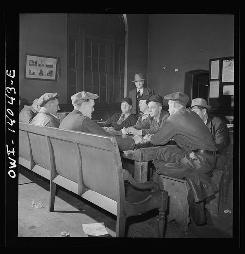 Clinton, Iowa. There is usually a game of cards in progress in the recreation room at the depot