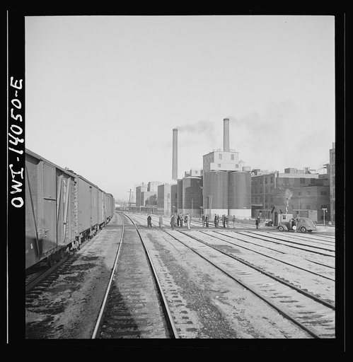 Freight train operations on the Chicago and Northwestern Railroad between Chicago and Clinton, Iowa. The train going through the town to the yard which is two miles beyond