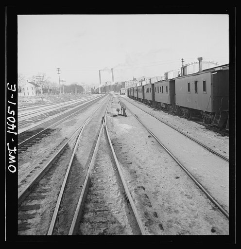Freight train operations on the Chicago and Northwestern Railroad between Chicago and Clinton, Iowa. The train going through the town to the yard which is two miles beyond