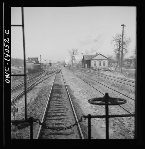 Freight train operations on the Chicago and Northwestern Railroad between Chicago and Clinton, Iowa. The train going through the town to the yard which is two miles beyond