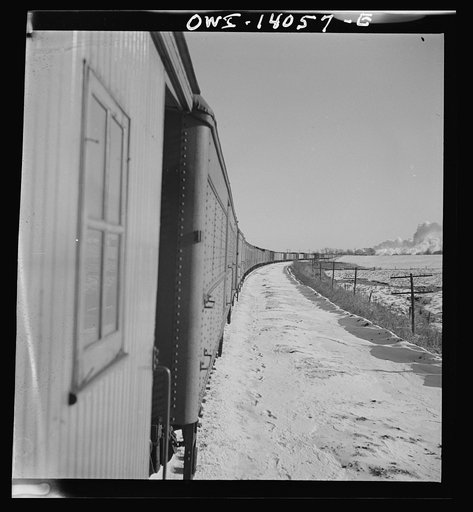 Untitled photo, possibly related to: Freight train operations on the Chicago and Northwestern Railroad between Chicago and Clinton, Iowa. The train rounds a long curve on its way back from Clinton