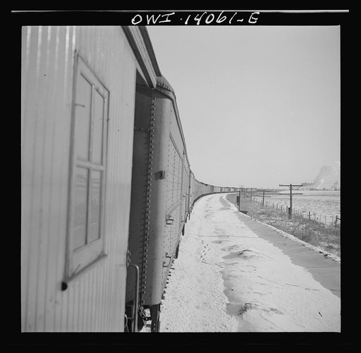 Freight train operations on the Chicago and Northwestern Railroad between Chicago and Clinton, Iowa. The train rounds a long curve on its way back from Clinton