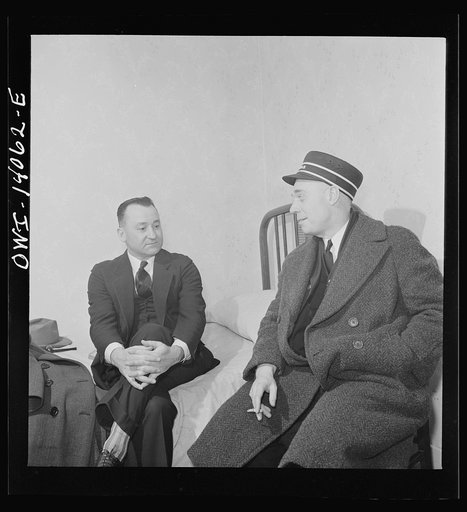 Clinton, Iowa. Lester Stein, a passenger brakeman visiting his friend Clarence Averill, a freight brakeman. Both are staying at the same rooming house
