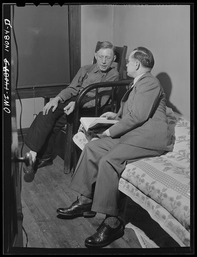 Gibson, Indiana. Mr. Rusine, manager of the railroad YMCA (Young Men's Christian Association) for twenty-seven years, paying a call on Mr. Hiram Gilman, engineer on the Michigan Central railroad, in the railroad YMCA