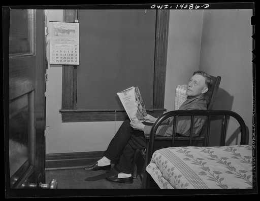 Untitled photo, possibly related to: Gibson, Indiana. Mr. Rusine, manager of the railroad YMCA (Young Men's Christian Association) for twenty-seven years, paying a call on Mr. Hiram Gilman, engineer on the Michigan Central railroad, in the railroad YMCA