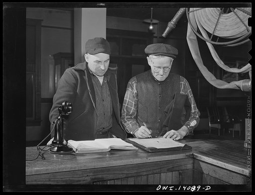 Gibson, Indiana. Lester Gale (left), signal maintainer, and Charles Cornetta, railroad mail clerk, registering at the railroad YMCA (Young Men's Christian Association)